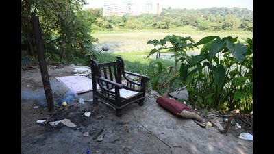 Lotus Lake in Nerul, around which encroachments are cleared by Navi Mumbai civic body while debris dumped there is in the process of being removed. (BACHCHAN KUMAR/HT PHOTO)