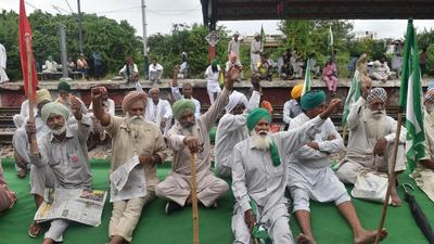 Farmers block railway tracks in protest against the violence in Lakhimpur Kheri, in Bahadurgarh. Police in Haryana’s Sirsa district have booked over 200 farmers allegedly for protest against the visit of BJP leaders to Talwara Khurd and Kotli villages to campaign for the upcoming Ellenabad assembly bypoll. (PTI) Farmers block railway tracks in protest against the violence in Lakhimpur Kheri, in Bahadurgarh. Police in Haryana’s Sirsa district have booked over 200 farmers allegedly for protest against the visit of BJP leaders to Talwara Khurd and Kotli villages to campaign for the upcoming Ellenabad assembly bypoll. (PTI)