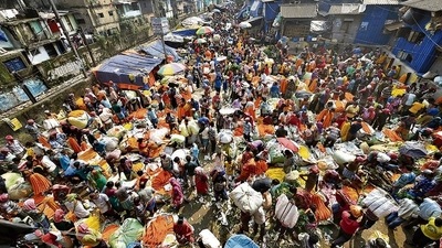 A crowded market ahead of Durga Puja, in Kolkata on Oct 11. (PTI) A crowded market ahead of Durga Puja, in Kolkata on Oct 11. (PTI)