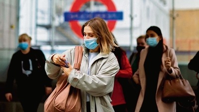 A commuter walks out of a underground train station in London. AFP A commuter walks out of a underground train station in London. AFP
