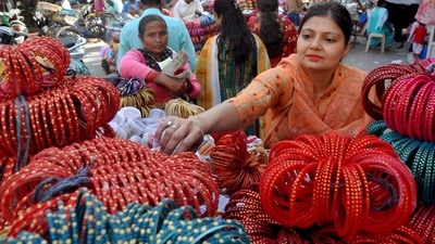 A women buy bangles ahead of the Karva Chauth festival, in Patiala. (ANI) A women buy bangles ahead of the Karva Chauth festival, in Patiala. (ANI)