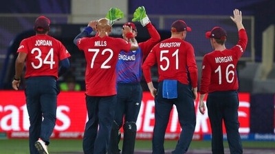 England's Tymal Mills, (72), celebrates after taking the wicket of West Indies' Nicholas Pooran caught out by England's Jos Buttler during the Cricket T20 World Cup match between England and the West Indies at the Dubai International Cricket Stadium, in Dubai, UAE, Saturday, Oct. 23, 2021 (AP) England's Tymal Mills, (72), celebrates after taking the wicket of West Indies' Nicholas Pooran caught out by England's Jos Buttler during the Cricket T20 World Cup match between England and the West Indies at the Dubai International Cricket Stadium, in Dubai, UAE, Saturday, Oct. 23, 2021 (AP)
