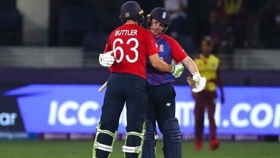 England's captain Eoin Morgan, right and teammate England's Jos Buttler hug after they defeated West Indies during the Cricket T20 World Cup match between England and the West Indies at the Dubai International Cricket Stadium, in Dubai, UAE, Saturday, Oct. 23, 2021. England won by 6 wickets. (AP Photo/Aijaz Rahi) (AP) England's captain Eoin Morgan, right and teammate England's Jos Buttler hug after they defeated West Indies during the Cricket T20 World Cup match between England and the West Indies at the Dubai International Cricket Stadium, in Dubai, UAE, Saturday, Oct. 23, 2021. England won by 6 wickets. (AP Photo/Aijaz Rahi) (AP)