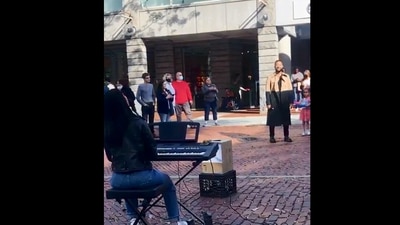 The image shows John Legend enjoying the performance. (Instagram/@radhamusic_)