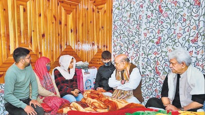 Union home minister Amit Shah visits the residence of J&K Police inspector Parvez Ahmed, who was killed by terrorists last month, in Nowgam on Saturday. (PTI) Union home minister Amit Shah visits the residence of J&K Police inspector Parvez Ahmed, who was killed by terrorists last month, in Nowgam on Saturday. (PTI)