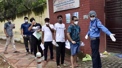 A security personnel screens NEET aspirants before allowing them in the exam centre at Delhi on the day of the exam on September 12. (HT FILE) A security personnel screens NEET aspirants before allowing them in the exam centre at Delhi on the day of the exam on September 12. (HT FILE)