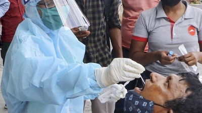 A health worker collects swab samples for Covid-19 tests in Nagpur, Maharashtra. (PTI) A health worker collects swab samples for Covid-19 tests in Nagpur, Maharashtra. (PTI)