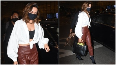 Earlier, Deepika Padukone was also snapped at the Mumbai airport wearing leather pants. While Kriti chose a lighter shade, Deepika, on the other hand, opted for dark brown-coloured leather pants. (HT Photo/Varinder Chawla) Earlier, Deepika Padukone was also snapped at the Mumbai airport wearing leather pants. While Kriti chose a lighter shade, Deepika, on the other hand, opted for dark brown-coloured leather pants. (HT Photo/Varinder Chawla)