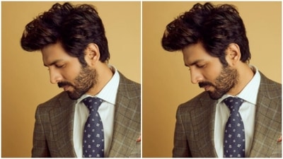 He teamed his formal date night look with a white shirt and a contrasting blue tie. (Instagram/@kartikaaryan) He teamed his formal date night look with a white shirt and a contrasting blue tie. (Instagram/@kartikaaryan)