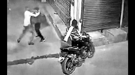 A closed circuit television camera installed in the Gandhi Nagar market captured the labourer getting robbed on Saturday morning. (HT Photo)