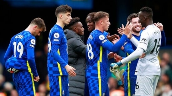 Chelsea's goalkeeper Edouard Mendy, right, celebrates with teammates at the end of the English Premier League soccer match between Chelsea and Norwich City at Stamford Bridge Stadium in London, Saturday, Oct. 23, 2021.(AP)