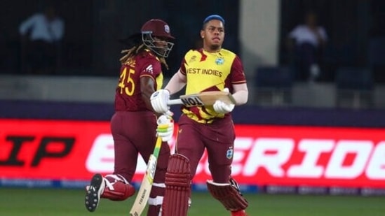 Emirates T20 World Cup Cricket 127 1635011084962 1635011231394 West Indies' Chris Gayle, left and West Indies' Shimron Hetmyer take runs during the Cricket T20 World Cup match between England and the West Indies at the Dubai International Cricket Stadium, in Dubai, UAE, Saturday, Oct. 23, 2021. (AP Photo/Aijaz Rahi)(AP)