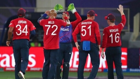 England's Tymal Mills, (72), celebrates after taking the wicket of West Indies' Nicholas Pooran caught out by England's Jos Buttler during the Cricket T20 World Cup match between England and the West Indies at the Dubai International Cricket Stadium, in Dubai, UAE, Saturday, Oct. 23, 2021(AP)