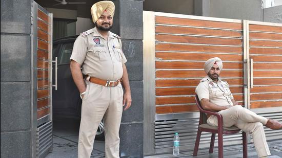 Police personnel deployed outside a house in Model Town area during income tax raids in Ludhiana on Thursday. (HT FILE)