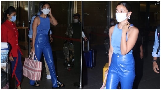Alia Bhatt also gave her followers tips on styling leather pants by going the extra mile. The actor chose a pair of high-waisted bright blue leather pants for her arrival in Mumbai. She teamed the pants with a crop top, a white face mask, and Louis Vuitton sliders.(HT Photo/Varinder Chawla)