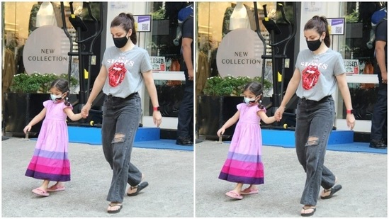 Soha Ali Khan sported a grey graphic tee shirt and a pair of distressed jeans as she was spotted walking out of a store in Bandra with Inaaya.(HT Photos/Varinder Chawla)