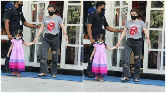 Inaaya is starting early in the fashion game. She wore a pink frock with blue and dark pink borders, and looked adorable as she held mom Soha’s hands.(HT Photos/Varinder Chawla)