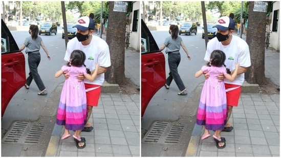 Kunal held Inaaya as they passed the paparazzi.(HT Photos/Varinder Chawla)