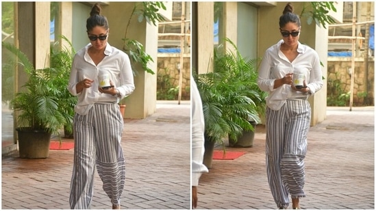 Kareena gave her Saturday morning look an upgrade with a chic combination. The mother-of-two wore a comfy white cotton button-down shirt featuring long sleeves with folded cuffs. In the end, a french tuck added an element of fun to her ensemble.(HT Photo/Varinder Chawla)