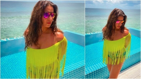 Bipasha Basu shows how to rock a fringes neon green top. She paired it with denim shorts and reflectors.(Instagram/@bipashabasu)