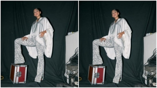 ‘In white,’ Mrunal Thakur is a imaginative and prescient to behold 2 She teamed a satin white top and paired it with a pair of checkered shimmery trousers.(Instagram/@mrunalthakur)