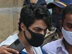 Aryan Khan, son of Shah Rukh Khan, is escorted to court by Narcotics Control Bureau (NCB) officials for a bail plea hearing. (AFP) Aryan Khan, son of Shah Rukh Khan, is escorted to court by Narcotics Control Bureau (NCB) officials for a bail plea hearing. (AFP)