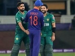 Indian cricket captain Virat Kohli congratulates Pakistan's Mohammad Rizwan, right, and Babar Azam after Pakistan won the Cricket Twenty20 World Cup match between India and Pakistan in Dubai, UAE, Sunday, Oct. 24, 2021. (AP Photo/Aijaz Rahi)(AP)