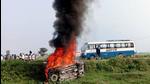 A vehicle set ablaze after violence broke out after farmers agitating were allegedly run over by a vehicle in the convoy of a union minister, in Lakhimpur Kheri on Sunday (ANI) A vehicle set ablaze after violence broke out after farmers agitating were allegedly run over by a vehicle in the convoy of a union minister, in Lakhimpur Kheri on Sunday (ANI)