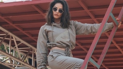 As athleisure wear continues to be a rage, Sunny Leone leaves fashionistas impressed with her spicy hot look from the sets of MTV Splitsvilla X3 in an old army green crop hoodie and a pair of similar-coloured joggers. (Instagram/sunnyleone) As athleisure wear continues to be a rage, Sunny Leone leaves fashionistas impressed with her spicy hot look from the sets of MTV Splitsvilla X3 in an old army green crop hoodie and a pair of similar-coloured joggers. (Instagram/sunnyleone)