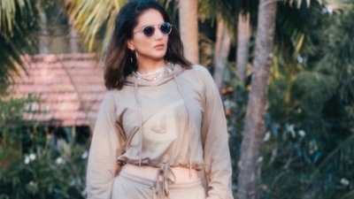 Taking to her social media handle, Sunny shared a slew of pictures featuring her in a relaxed fit, reglan sleeve crop hoodie that came with a drawstring tie up at the waist and a chest embroidery. (Instagram/sunnyleone) Taking to her social media handle, Sunny shared a slew of pictures featuring her in a relaxed fit, reglan sleeve crop hoodie that came with a drawstring tie up at the waist and a chest embroidery. (Instagram/sunnyleone)