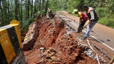 A damaged road after a landslide due to heavy rain near Chikmagalur on October 22. (PTI) A damaged road after a landslide due to heavy rain near Chikmagalur on October 22. (PTI)