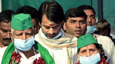 RJD president Lalu Prasad with his wife Rabri Devi and son Tej Pratap at the airport in Patna on Sunday. (ANI Photo) RJD president Lalu Prasad with his wife Rabri Devi and son Tej Pratap at the airport in Patna on Sunday. (ANI Photo)