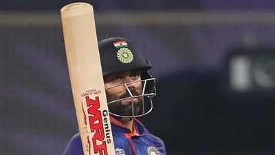 Dubai: Indian cricket captain Virat Kohli celebrates after scoring half a century during the Cricket Twenty20 World Cup match between India and Pakistan in Dubai, UAE, Sunday, Oct. 24, 2021. AP/PTI Photo(AP10_24_2021_000193A) (AP) Dubai: Indian cricket captain Virat Kohli celebrates after scoring half a century during the Cricket Twenty20 World Cup match between India and Pakistan in Dubai, UAE, Sunday, Oct. 24, 2021. AP/PTI Photo(AP10_24_2021_000193A) (AP)