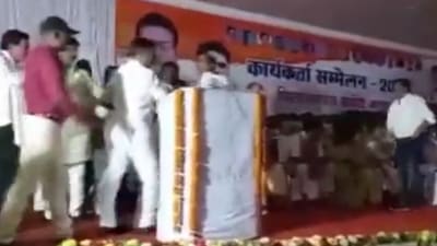 Video grab of Congress leader Pawan Agarwal being stopped from going ahead with his speech. (ANI Twitter)