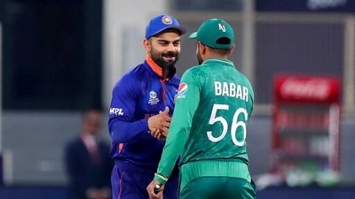 India's captain Virat Kohli, left, and Pakistan's captain Babar Azam shake hands after the toss ahead of the Cricket Twenty20 World Cup match between India and Pakistan in Dubai, UAE, Sunday, Oct. 24, 2021. (AP Photo/Aijaz Rahi) (AP) India's captain Virat Kohli, left, and Pakistan's captain Babar Azam shake hands after the toss ahead of the Cricket Twenty20 World Cup match between India and Pakistan in Dubai, UAE, Sunday, Oct. 24, 2021. (AP Photo/Aijaz Rahi) (AP)
