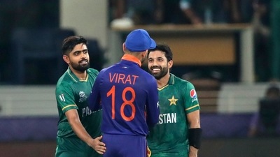 Indian cricket captain Virat Kohli congratulates Pakistan's Mohammad Rizwan, right, and Babar Azam after Pakistan won the Cricket Twenty20 World Cup match between India and Pakistan in Dubai, UAE, Sunday, Oct. 24, 2021. (AP Photo/Aijaz Rahi) (AP) Indian cricket captain Virat Kohli congratulates Pakistan's Mohammad Rizwan, right, and Babar Azam after Pakistan won the Cricket Twenty20 World Cup match between India and Pakistan in Dubai, UAE, Sunday, Oct. 24, 2021. (AP Photo/Aijaz Rahi) (AP)