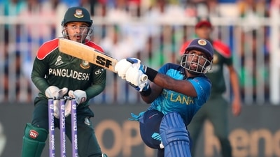 Sri Lanka's Charith Asalanka hits the ball for four runs during the Cricket Twenty20 World Cup match between Sri Lanka and Bangladesh in Sharjah, UAE, Sunday, Oct. 24, 2021. (AP) Sri Lanka's Charith Asalanka hits the ball for four runs during the Cricket Twenty20 World Cup match between Sri Lanka and Bangladesh in Sharjah, UAE, Sunday, Oct. 24, 2021. (AP)