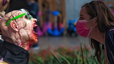 A woman observes a zombie figure put on display at a shopping centre as part of the Halloween season decorations, in San Pedro Garza, Nuevo Leon State, Mexico. (AFP) A woman observes a zombie figure put on display at a shopping centre as part of the Halloween season decorations, in San Pedro Garza, Nuevo Leon State, Mexico. (AFP)