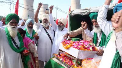 Members of Samyukt Kisan Morcha with the ashes of farmers killed in Lakhimpur Kheri, in Bathinda on Sunday. (Sanjeev Kumar/HT)