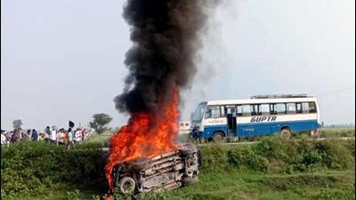A vehicle set ablaze after violence broke out after farmers agitating were allegedly run over by a vehicle in the convoy of a union minister, in Lakhimpur Kheri on Sunday (ANI) A vehicle set ablaze after violence broke out after farmers agitating were allegedly run over by a vehicle in the convoy of a union minister, in Lakhimpur Kheri on Sunday (ANI)