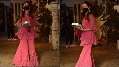 The sharara set featured a short kurta decorated with polka dot print, frilled tiers, bell sleeves, gota embroidery and mirror work on the crew-neckline. The fit-and-flare silhouette of Mira's kurta added a contemporary touch to her Karva Chauth look. (HT Photo/Varinder Chawla) The sharara set featured a short kurta decorated with polka dot print, frilled tiers, bell sleeves, gota embroidery and mirror work on the crew-neckline. The fit-and-flare silhouette of Mira's kurta added a contemporary touch to her Karva Chauth look. (HT Photo/Varinder Chawla)