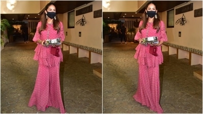 Mira teamed the kurta with a matching sharara. The co-ord pants came adorned with polka dot prints and a flared hemline. A pair of strappy gold sandals, a small embellished red clutch, traditional gold jhumkis, emerald bracelets, and diamond rings rounded off the accessories. (HT Photo/Varinder Chawla) Mira teamed the kurta with a matching sharara. The co-ord pants came adorned with polka dot prints and a flared hemline. A pair of strappy gold sandals, a small embellished red clutch, traditional gold jhumkis, emerald bracelets, and diamond rings rounded off the accessories. (HT Photo/Varinder Chawla)
