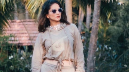 Taking to her social media handle, Sunny shared a slew of pictures featuring her in a relaxed fit, reglan sleeve crop hoodie that came with a drawstring tie up at the waist and a chest embroidery.(Instagram/sunnyleone)