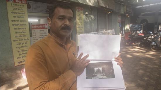 Sameer Nikam, history enthusiast shows documents related to tombstones in Pune. Not only Sinhagad fort and Shaniwar Wada, Pune city is home to a host of historical places, many of which are fast disappearing. (Pratham Gokhale/HT Photo)