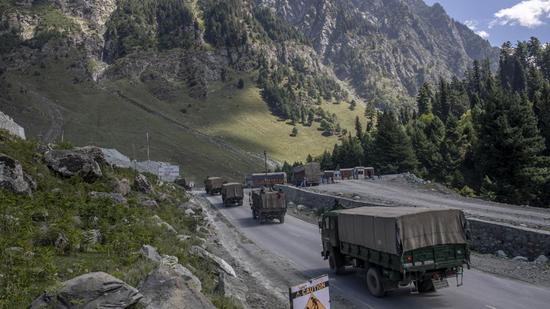 An Indian army convoy moves on the Srinagar-Ladakh highway at Gagangeer, northeast of Srinagar, Jammu & Kashmir. China has passed a new law to strengthen and govern its land borders amid the ongoing military tension along the disputed boundary with India. (AP)