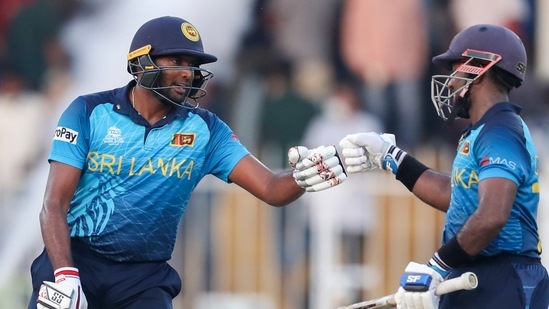 Sharjah : Sri Lanka's Bhanuka Rajapaksa, left, and Charith Asalanka gesture to each other during the Cricket Twenty20 World Cup match between Sri Lanka and Bangladesh in Sharjah, UAE, Sunday(AP)