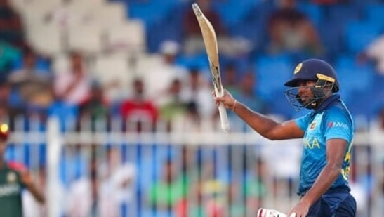 Sri Lanka's Bhanuka Rajapaksa reacts after scoring 50 runs during the Cricket Twenty20 World Cup match between Sri Lanka and Bangladesh in Sharjah, UAE, Sunday, Oct. 24, 2021. (AP)