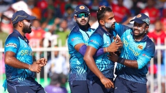 Sri Lanka's Chamika Karunaratne, second right, is congratulated by teammates after dismissing Bangladesh's Shakib Al Hasan during the Cricket Twenty20 World Cup match between Sri Lanka and Bangladesh in Sharjah, UAE, Sunday, Oct. 24, 2021. (AP)