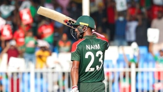 Bangladesh's Mohammad Naim waves his bat after scoring 50 runs during the Cricket Twenty20 World Cup match between Sri Lanka and Bangladesh in Sharjah, UAE, Sunday, Oct. 24, 2021. (AP)