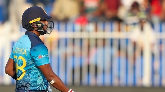 Sri Lanka's Avishka Fernando walks from the field after he was dismissed for no score during the Cricket Twenty20 World Cup match between Sri Lanka and Bangladesh in Sharjah, UAE, Sunday, Oct. 24, 2021. (AP)